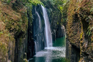Fotobehang waterfall in the mountains © worm_ flag