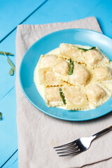 Italian pasta ravioli on wooden rustic background