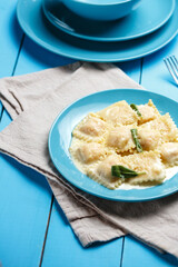 Italian pasta ravioli on wooden rustic background