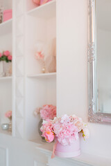 Beautiful bouquet of flowers in round box and pink gift box. Gift for holiday, birthday, Wedding, Mother's Day, Valentine's day, Women's Day. Floral arrangement in a hat box.