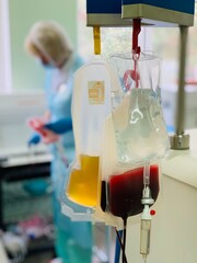 donor is donating plasma. Blood donation process at a hospital ward. Blood donations save lives...