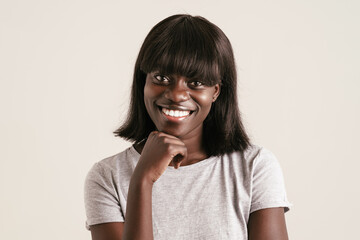 Portrait of young beautiful smiling african woman with bob haircut