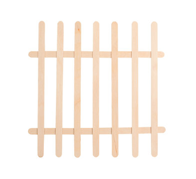 Fence made of wooden lolly or ice-cream sticks isolated.