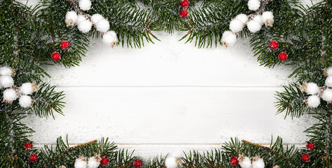 Fototapeta na wymiar Christmas and New Year composition of fir branches and snowflakes in the form of a frame. Banner. Winter background. Flatlay. Top view. Copy space.