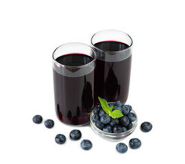 Delicious natural berry juice in glasses isolated on white background. Preparation of natural juices. Сlose-up.