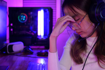 online game streamer feeling disappointed, Female gamer having eye strain and headache after lose...