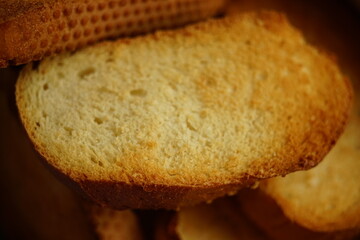 Fresh baked sandwich, pieces of crispy bread close-up