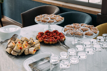 Snack during lecture. Buffet. Canapes and sweets.