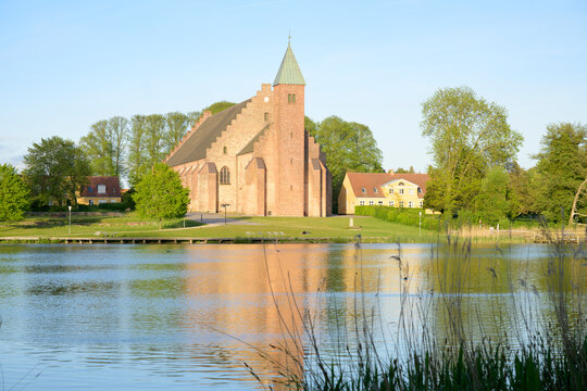 The Maribo Cathedral by the lake S&oslash;nders&oslash; in the evening sun