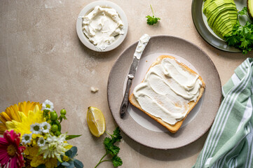 Toasted bread with cream cheese and avocado. Healthy food concept.