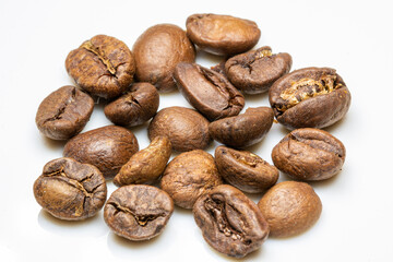  heap of medium Roasted coffee beans on white background. macro photo