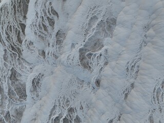Pamukkale Travertines Cinematic Aerial Drone footage. Turkish famous white thermal bath with healthy clean water in a beautiful sunset. 