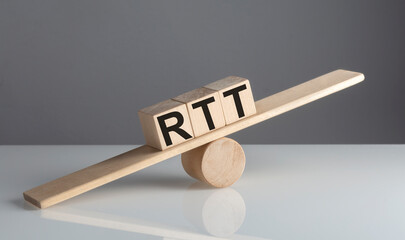 RTT on wooden cubes on a wooden balance , business concept