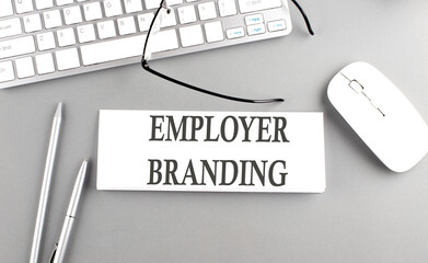EMPLOYER BRANDING text on paper with keyboard on grey background