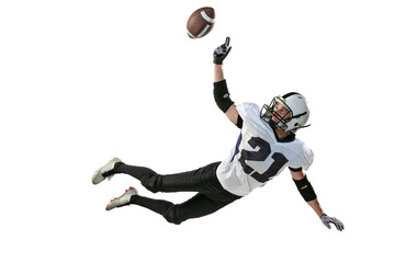 Portrait of american football player in motion, catching ball in a jump isolated over white background. Training before game
