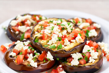 close up homemade eggplant salad with cheese and tomatoes,selective focus.