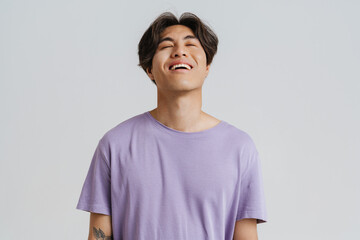 Young handsome relaxed asian boy with closed eyes