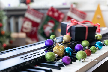 Piano keyboard with Christmas decoration, closeup