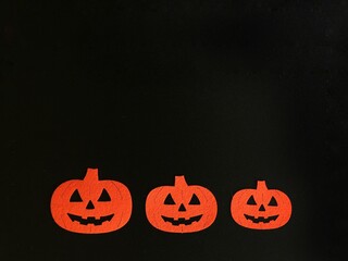 Three Beautiful pumpkin on a black background. Creative halloween concept backdrop. halloween pumpkin craft	