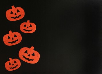 Beautiful pumpkin on a black background. Creative halloween concept backdrop. halloween pumpkin craft	