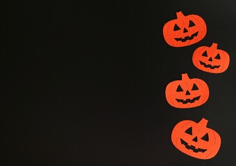 Beautiful pumpkin on a black background. Creative halloween concept backdrop. halloween pumpkin craft	