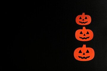 Three Beautiful pumpkin on a black background. Creative halloween concept backdrop. halloween pumpkin craft