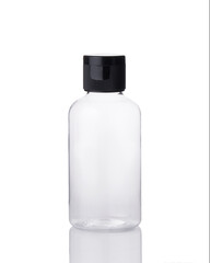Plastic empty bottle with black lid isolated on white background