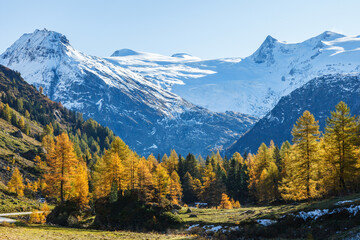 Scenic view at snow capped mountains in autumn