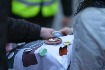 Chest badges for sale from a street vendor