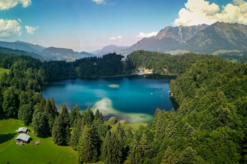 Fototapeta na wymiar Mountains and lake panorama in Bavarian Alpes near Obersdorf, Germany. 