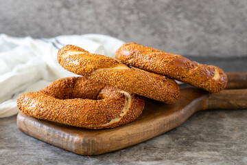 Sesame bagel. Turkish bagel on dark background. Bakery products. close up