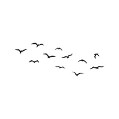 A flock of flying silhouette birds. Vector illustration