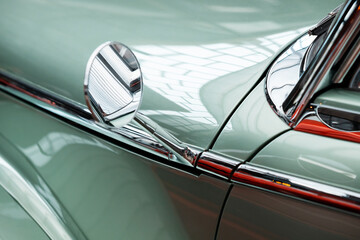rearview mirror in a retro car. Old-school style for motorists. Vintage automobile details
