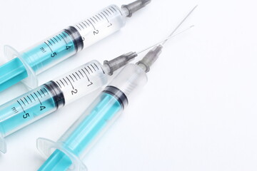 Medical syringe on a white background. A syringe for injection. The concept of health and beauty