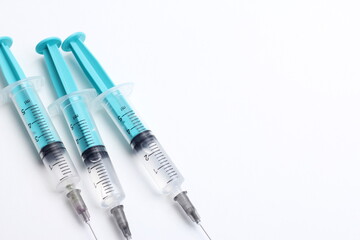 Medical syringe on a white background. A syringe for injection. The concept of health and beauty