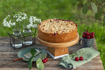 sour cherry crumble cake on  wooden table