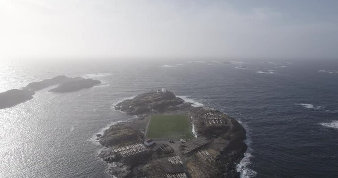 Aerial view of a soccer field in the ocean in norway lofoten