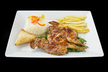 grilled wings with vegetables and fried potatoes and some rice