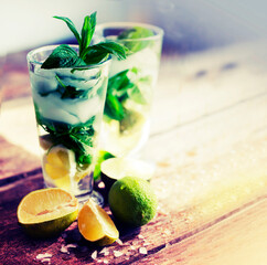 cvacktail mojito with ice over wooden rustic background
