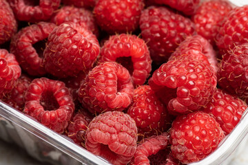 Ripe raspberries. Berries. A handful of raspberries. Scarlet. Raspberry field. Raspberry juice. 