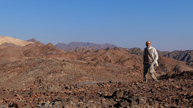 Senior Man Walking In The Desert