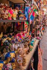 Beautiful and colorful bulls of Pucara the handicraft market in the city of Pisac, in Peru.  - obrazy, fototapety, plakaty