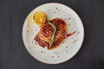 Meat steak with lemon. A dish from the chef for serving in a restaurant.