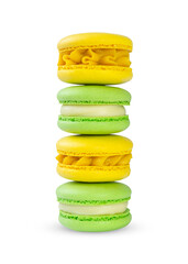 stack of yellow and green macarons isolated on white
