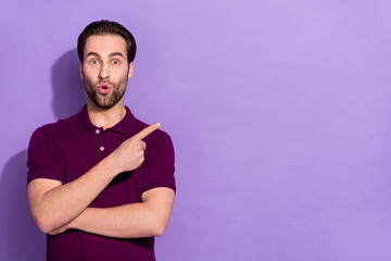 Photo of funny impressed guy see unbelievable information promote cool product isolated on purple color background
