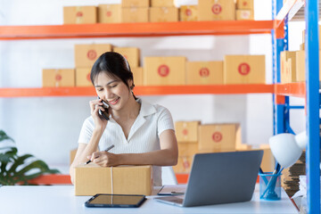 Starting small businesses SME owners female entrepreneurs check online orders to prepare to pack the boxes, sell to customers, sme business ideas online.