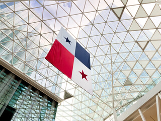 Panamanian flag hanging from a glass roof in a shopping center