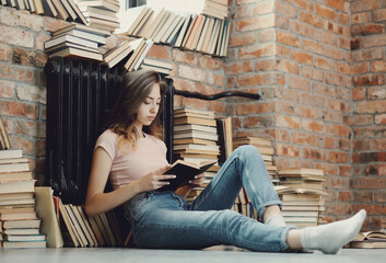 Comfortable and Cozy: Blonde Girl Posing in Various Relaxing Positions at Home, Reading and Working on Laptop