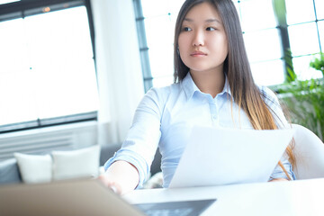 Post-Office Serenity: A Young Asian Woman Captured in Different Poses during a Relaxing Photoshoot