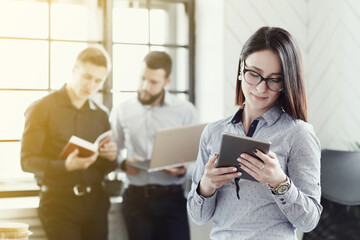 Collaborative Problem-Solving: Two Men and One Woman Engaged in a Productive Business Meeting